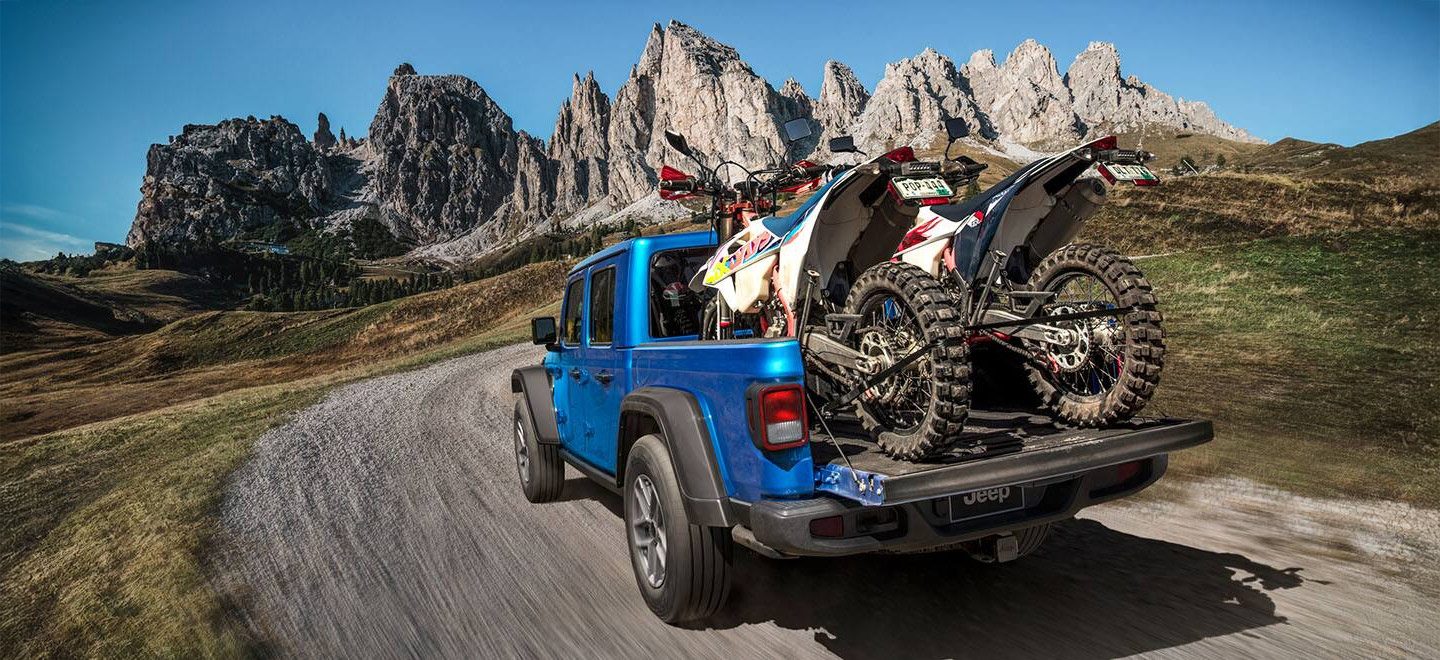 Jeep Gladiator carrying 2 dirtbikes in the mountains